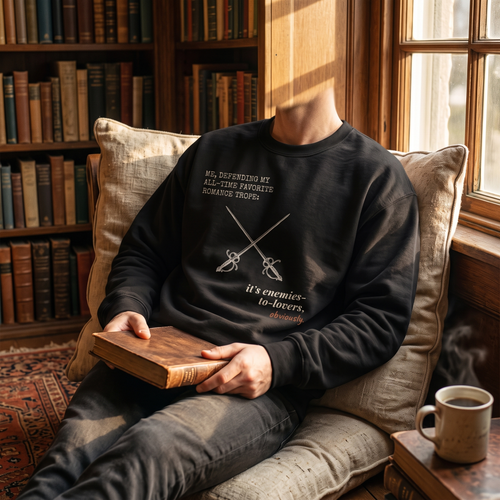 Me, defending my all-time favorite romance trope — it’s enemies-to-lovers, obviously — sweatshirt worn by a reader