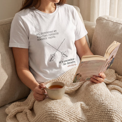 Me, defending my all-time favorite romance trope — it’s enemies-to-lovers, obviously — t-shirt worn by a reader