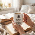 Emotionally Bonded to a Fictional Dragon — mug in a reader’s hands
