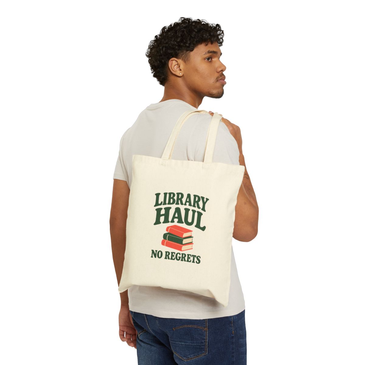 Library Haul No Regrets Canvas Tote — Natural 15 × 16 inch cotton canvas tote, supplier worn mockup, printed front