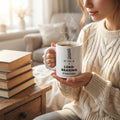 My TBR Is a Load-Bearing Structure — mug in a reader’s hands