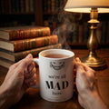We're all mad here — mug in a reader’s hands